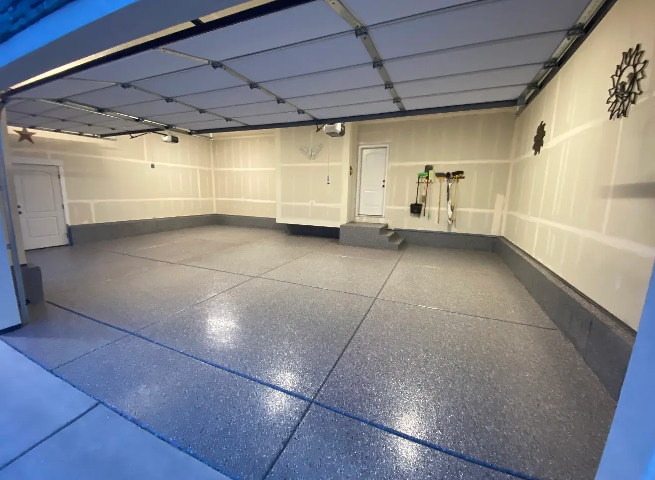 Garage with dark flake coating at dusk